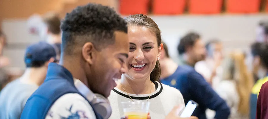 Male and female MBA students socializing